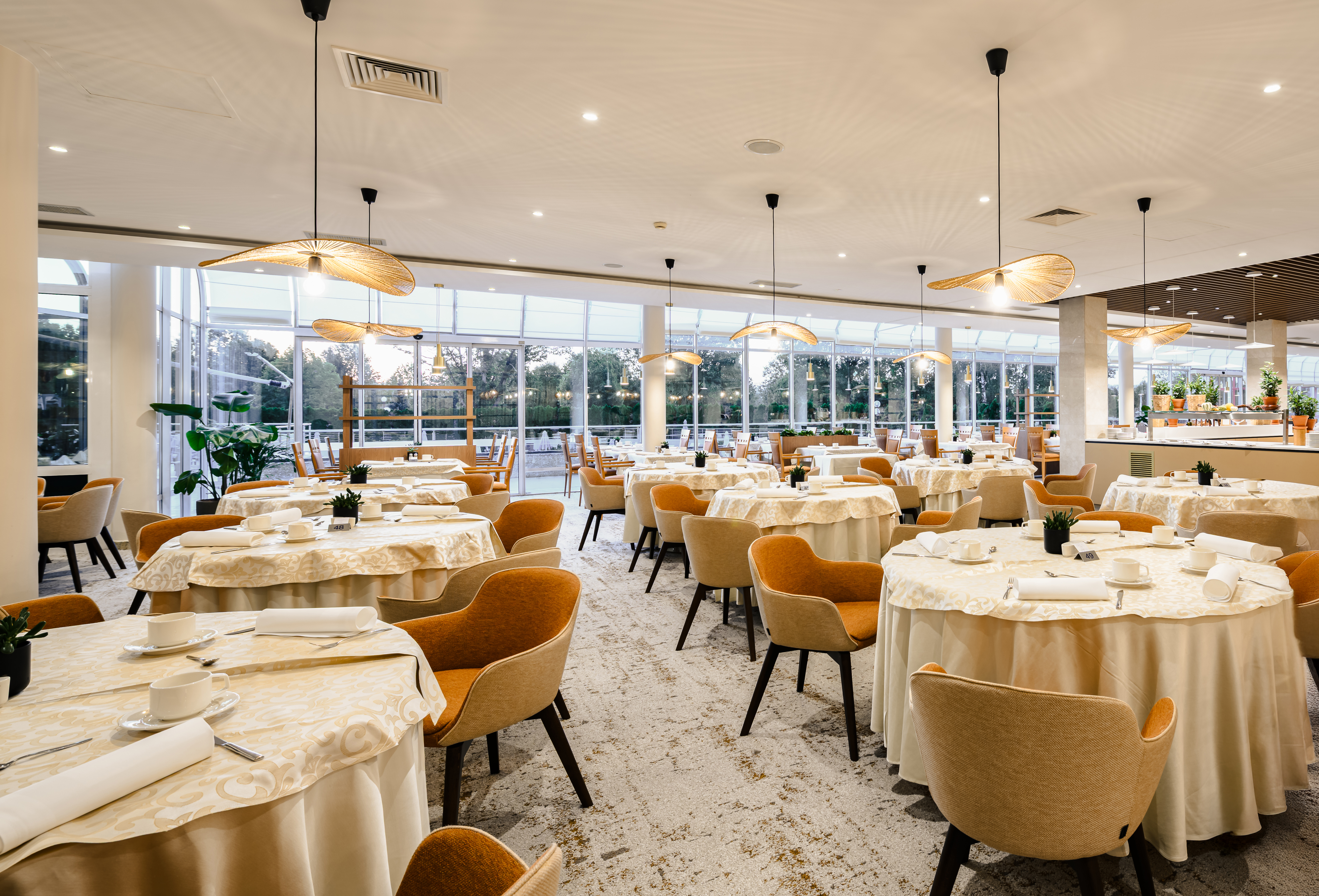 Dining area with set tables in the restaurant at Hotel Livada Prestige