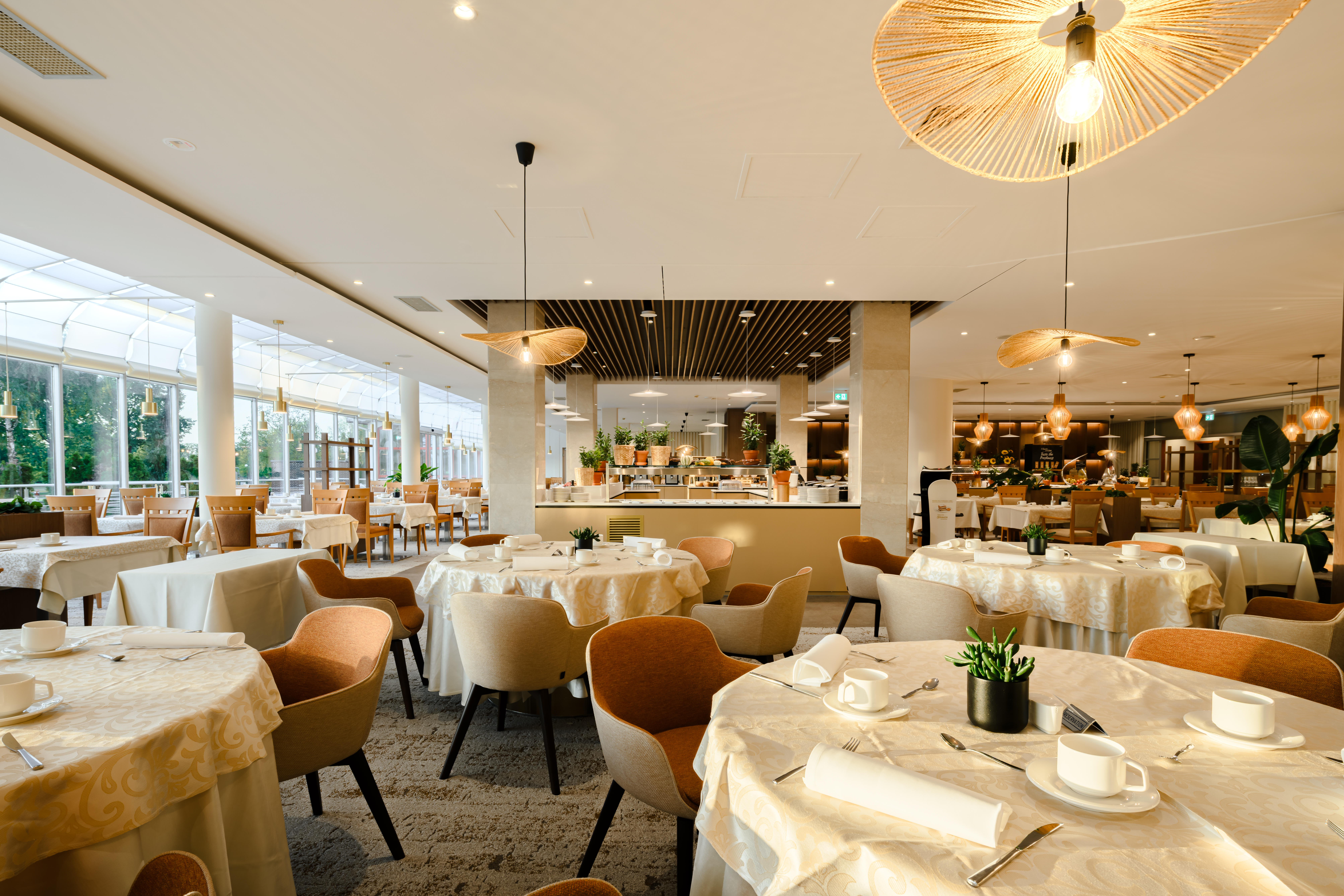 Interior of the restaurant with set tables at Hotel Livada Prestige